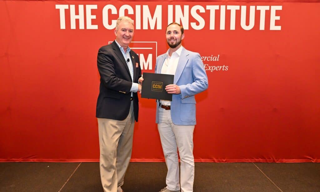 Colin Pancrazi receiving the CCIM designation at the 2025 pinning ceremony in Miami, celebrating achievement in commercial real estate.
